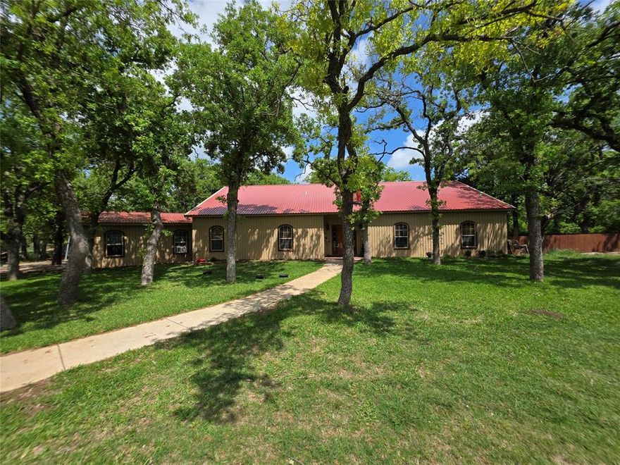 Folks! If you are looking for a beautiful property in the country to call your own, this is the one for you! This property is a very nice place, one to be proud of! This ranchette has a lot to offer. When you enter the property, you will drive up the long, tree lined driveway, to a very nice all metal 2490 sf (per CAD) 3 bd 2.5 bth home with loft. Home has great curb appeal. Home offers an open floor plan, with separate dining room, and utility room. There is a nice large front yard and back yard, with a sprinkler system to keep yard looking nice. There is a nice, large back porch, to relax on, after a hard days work. Other improvements include a nice 2100 sf (per CAD) all metal workshop, with an attached 900 sf, 1 bd 1 bth apartment. Other improvements include a 50 x 17 RV shed, and 630 sf 3 sided shed. The land is mostly wooded with nice large Post Oak, Blackjack Oak, Mesquite, Cottonwood, and other brush and browse for the abundant wildlife. Wildlife consist of Deer, Dove, Turkey, Hogs, and varmints. There is 1 nice tank, and 1 water well in place, plus county water to home. Ag exemption is in place. There is lots of fantastic native grasses, so you can run a few head of livestock, if so choose. Don't miss out on this gem of a ranchette!