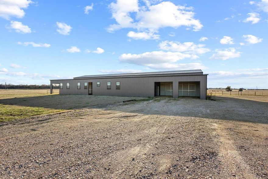 Finish this one the way you want!  9,360 sq ft Metal building. Front area for living quarters and back area has 3 stalls, an RV hook-up.  So much potential to create whatever you want.  The 14.494 acres are fenced and cross fenced with a pond. Electricity already to the building and water meter on property.  Call for information.
Additional 7.49 acres available adjoining this property to the south.