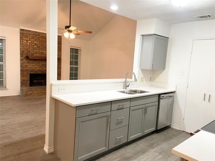 This charming cottage-style home offers a beautifully renovated, light-filled living space with an open-concept floor plan. It's located in the Timberline Estates neighborhood, ACROSS THE STREET FROM GRAPEVINE HIGH SCHOOL, and is both stylish and practical.  The gourmet kitchen has been fully updated with brand-new appliances, electric cooktop with 2 ovens and elegant quartz countertops, microwave and dishwasher.  Stainless Steel Refrigerator is provided. The seamless, open floor plan flows effortlessly, creating an ideal setting for entertaining or daily living.  A charming fireplace enhances the home's warm and inviting ambiance.  Includes a spacious primary bedroom with connected bathroom, extra guest bedroom downstairs and a second private primary bedroom with its own ensuite bathroom on the upper level.  A long driveway leads to a detached garage at the rear of the property, providing ample 2 car parking garage and storage.
Prime location situated in the desirable Grapevine-Colleyville ISD, the home is conveniently located just a short commute from Dallas and Fort Worth.  Pet-friendly: This property allows pets, with certain breed and size restrictions.
Recreation and parks:  Parr Park: This large, popular park is about a mile away and features extensive playgrounds, paved trails, and a spray ground for cooling off in the summer.  Bear Creek Park: Located roughly 1.4 miles away, this park offers a dog park, a disc golf course, baseball fields, and trails.  Grapevine Botanical Gardens at Heritage Park: A short drive away, these award-winning gardens are an ideal spot for a relaxing stroll.
Grapevine Lake: The lake and its many parks, including Meadowmere Park and Katie's Woods Park, are just minutes away and offer fishing, hiking, and water activities.  Grapevine Historic Main Street District: A vibrant destination with historic buildings housing shops, boutiques, galleries, and an extensive selection of restaurants.  Nearby grocery options about a mile away.