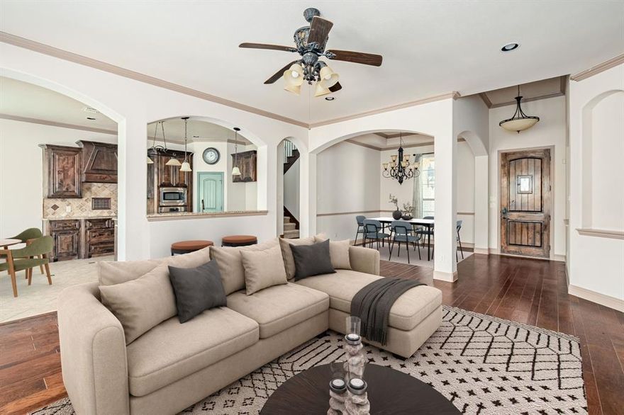 Situated on almost half an acre, this custom built 4 or 5 bedroom home is minutes from the prestigious Eagle Mountain High School.  The beautiful stone elevation welcomes you to a spacious, extended driveway for plenty of parking.  The covered front porch is a perfect spot for a coffee.  Enter to find hardwood flooring & an open floor plan including a formal dining, living room both open to the spacious kitchen.  The wood burning fireplace centers the living area & the kitchen has granite counters, a separate bar area, island & stainless appliances.  The primary bedroom is privately located near the back of the home with bay windows & a luxurious bathroom.  All carpets have been recently replaced & walls repainted.  The secondary bedrooms are located in a separate wing with a full bath nearby with double sinks.  Upstairs is another bedroom or spacious game room with a full bathroom.  Enjoy your spacious back patio overlooking the large yard with shed included.  Bring your eye for design to personalize the expanded backyard space that lies beyond the back fence.  Minutes from Eagle Mountain Lake.