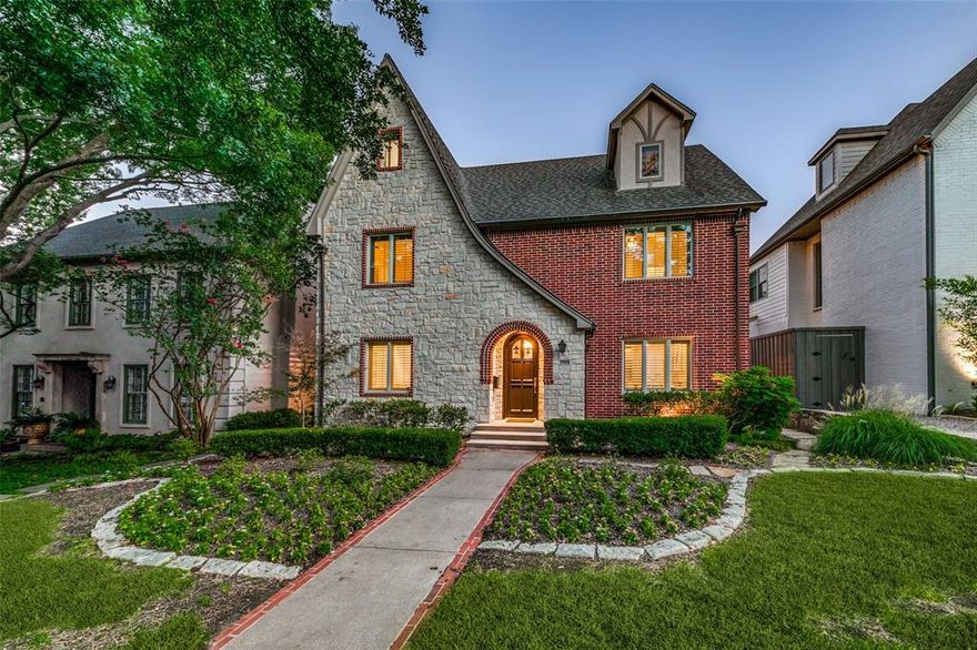 Nestled on a picturesque tree lined street in University Park, this Tudor style home seamlessly blends timeless elegance with modern updates. Three levels of rich hardwood flooring guide you through an impeccably designed interior. The main level welcomes you with a cozy living area featuring a classic fireplace and an elegant dining room. The updated kitchen boasts high end appliances including a Viking range, new Kitchenaid dishwasher, and stainless steel refrigerator, complemented by two pantries, a breakfast bar, and a charming eating area.

Upstairs, four bedrooms share Jack and Jill baths, alongside a convenient utility room. The top floor offers a sprawling bedroom suite or versatile game room or playroom with ample closets and a spacious bath. A separate 704 square foot guest quarters above the spacious three car garage provides privacy and comfort. Situated near Burleson Park and SMU in HPISD, this home is a true gem in one of Dallas' most sought after neighborhoods.