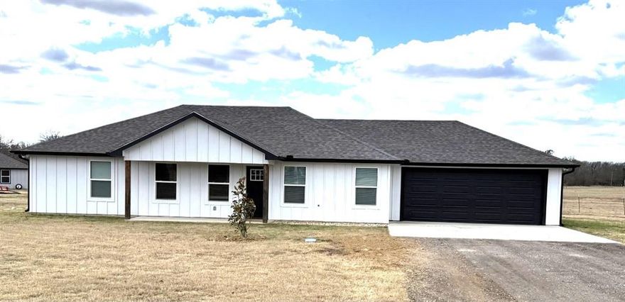 CUSTOM BUILT 3 BEDROOM 2 BATH 2 CAR GARAGE ON .53 ACRE LOT WITH FABULOUS VIEW OF THE COUNTRY ON A CULDASAC JUST MINUTES FROM PARIS TX ON HWY 82 E. OPEN FLOOR PLAN FEATURES LIVING ROOM WITH BEAM CEILING AND PLENTY OF LIGHTING. KITCHEN HAS AN ABUNDANCE OF CABINETS AND BEAUTIFUL QUARTZ COUNTERTOPS FEATURING A FARMHOUSE SINK AND PANTRY. STAINED CONCRETE FLOORING THROUGHOUT THE HOME WITH SPLIT BEDROOM ARRANGEMENT. PRIMARY BEDROOM HAS ENSUITE BATHROOM WITH GRANITE COUNTERS FEATURING DOUBLE SINKS AND A LARGE WALK-IN SHOWER. HOME IS LOCATED IN A QUIET ADDITION WITH BEAUTIFUL VIEWS PERFECT FOR FAMILY AND ENJOYING THE OUTDOORS.