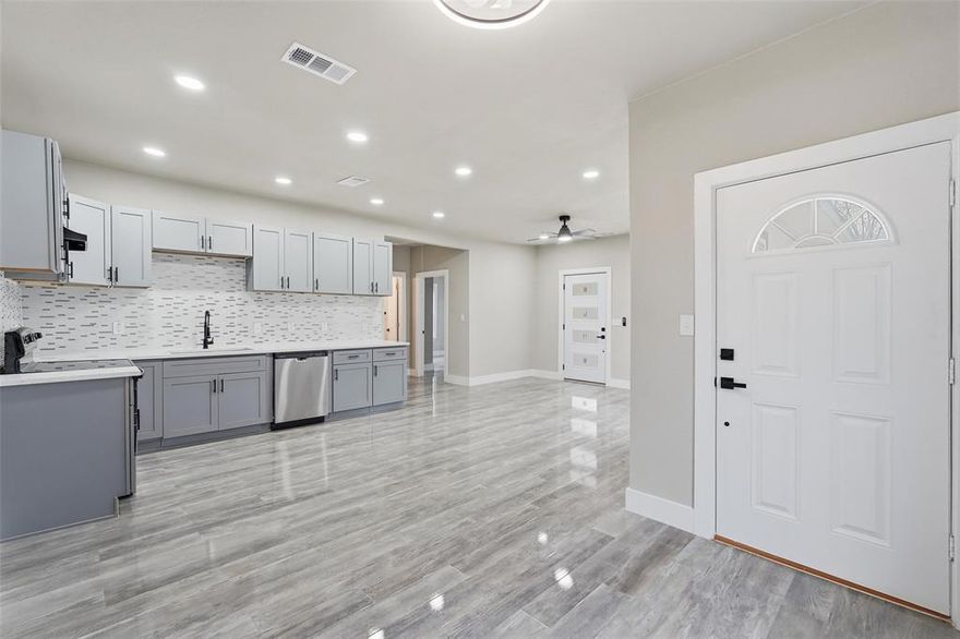 Completely reimagined and expertly renovated, this stunning residence showcases a sophisticated blend of modern design and thoughtful craftsmanship. The expansive open-concept living space is filled with natural light and enhanced by sleek flooring, recessed lighting throughout, and clean architectural lines that create an airy, contemporary atmosphere.
At the heart of the home, the designer kitchen impresses with custom cabinetry, quartz countertops, stainless steel appliances, and a beautifully detailed tile backsplash. The space is offers abundant storage, and an effortless flow for entertaining and everyday living. With generous prep space as well, the kitchen was designed to be both functional and visually striking.
The seamless layout opens to a generous living and dining area framed by large windows, allowing natural light to pour in, while maintaining a bright and welcoming ambiance. Modern fixtures, crisp trim work, and carefully curated finishes throughout the home contribute to its refined, move-in-ready appeal. Every detail has been thoughtfully updated to deliver a polished, contemporary living experience—making this beautifully renovated home a standout opportunity for those seeking style, comfort, and quality. The flexible layout allows for multiple living and dining configurations, making the home ideal for growing families, entertaining guests, or creating dedicated work-from-home space. Step outside to enjoy the private yard, offering the perfect space for relaxing, entertaining, pets, or weekend gatherings.
With its spacious feel, thoughtful updates, and inviting layout, this home offers exceptional comfort and value when shopping for a new turn key home in the heart of Dallas!