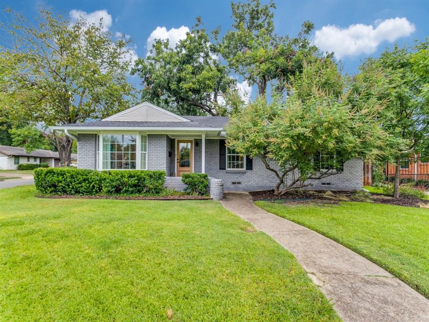 Positioned on a corner lot in the highly desirable University Terrace neighborhood and zoned to coveted Lakewood Elementary, this thoughtfully updated home is a true standout in the heart of East Dallas. Abundant natural light pours throughout, showcasing hardwood floors that run seamlessly from room to room. The island kitchen is appointed with Carrara marble countertops and a full marble backsplash, complemented by a sleek stainless appliance package. Luxurious bathrooms have been elevated with premium Brizo fixtures, marble counters, and refined tile work. The open-concept kitchen flows effortlessly into the living area, creating an inviting backdrop for both everyday living and entertaining. A versatile sitting room adapts easily to a playroom, home office, or additional lounge space. Step outside to a covered patio that opens to a generously sized backyard — ideal for relaxation or recreation. An attached two-car garage completes the picture. For added piece of mind, the crawl space has been fully encapsulated to to seal and protect the foundation and crawlspace of the house. Minutes from White Rock Lake, top local dining, and all the amenities East Dallas has to offer. This one checks every box.