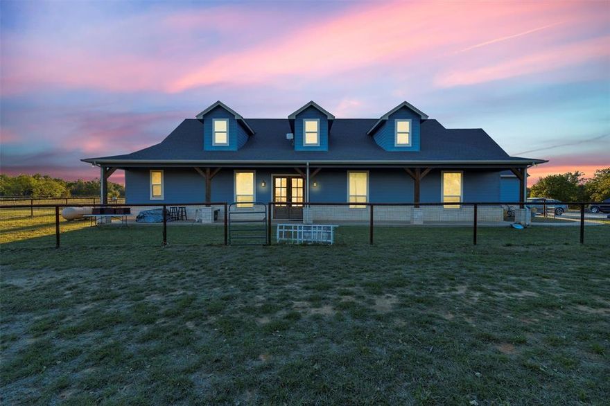 It doesn’t get more beautiful than this. Five bedrooms, three bathrooms, and a Modern Farmhouse vibe sitting on peaceful private acreage. From the moment you walk in, the 20-plus-foot ceilings hit you, open, bright, and just breathtaking.  The kitchen is truly the heart of the home here… quartz counters, GE Café appliances, a huge walk-in pantry, t’s a setup that makes cooking and hosting actually fun. The oak-tone luxury vinyl plank floors run throughout and give the whole space that warm, elevated feel without being high-maintenance.  The property is on a water oxidation and purification system, so the whole home is served with clean, high-quality water straight to every tap.  This place was built smart, too. Full spray-foam insulation for comfort and efficiency.  Outside you’ve got massive front and back porches perfect for morning coffee, game day barbecues, or long slow evenings, it all fits. And the oversized 3-car garage gives you room for vehicles, storage, and toys.  The surrounding acreage gives you privacy without isolation, you’re only minutes from town, but it feels like you’re miles away.  If you’ve been waiting on a place that you won’t have to compromise on, this is it.