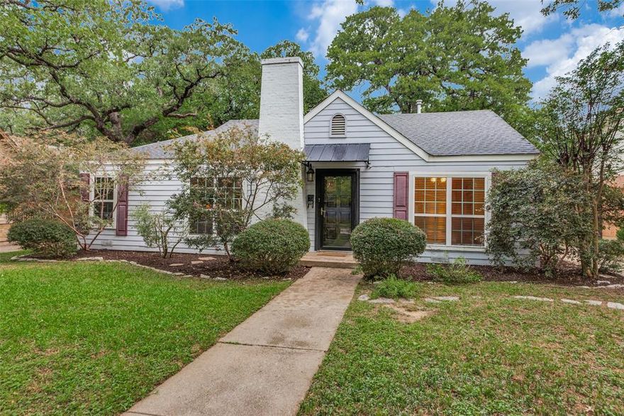 Nestled in the charming historic Oakhurst neighborhood, this home offers timeless curb appeal with mature trees, sidewalks, and inviting character throughout. Step inside to a spacious living room that is centered around a cozy gas-burning fireplace, creating the perfect gathering space. Featuring 2 generous sized bedrooms and 1 bath. The home also offers two dining areas — a formal dining room plus an eat-in kitchen area overlooking the oversized backyard. A warm and inviting bonus room with rich wood paneling and built-in bookcases provides endless flexibility as a second living area, home office, or add a closet to easily convert to a third bedroom. Architectural details like arched doorways and beautiful wood floors add to the home’s charm. The kitchen is both stylish and functional with a copper sink, granite countertops, gas range and abundant cabinetry.
Expansive backyard offers a bricked patio perfect for entertaining or relaxing. Garage with electric opener. Convenient access to I-35, Highway 287, and Highway 121.