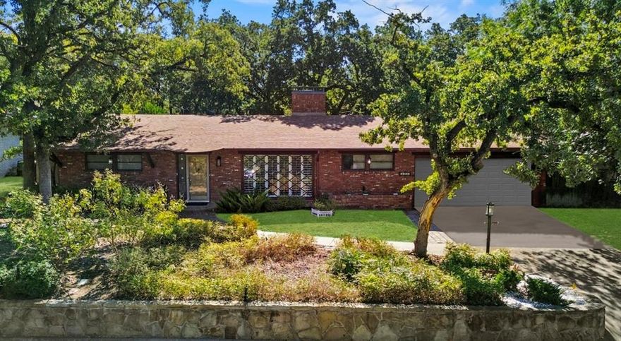 SELLER IS RELOCATING AND IS MOTIVATED TO SELL! Welcome to 5754 Blueridge Drive a charming 1950’s ranch home nestled in the heart of Eastern Hills. With 1,912 SF of living space on a 7,735 SF lot, this 3-bedroom, 2-bath residence blends mid-century character with modern updates. Step inside to warm wood flooring and abundant natural light from the expansive picture windows in the formal living and dining rooms.  The updated kitchen features stainless steel appliances, a farmhouse sink, granite countertops, and a built-in microwave ideal for both everyday use and entertaining.  The kitchen opens to a cozy eating area and an inviting family room with a fireplace and a wall of windows overlooking the lush, landscaped yard. Outside, the lot is beautifully treed, with ambient lighting in the front and back perfect for evening gatherings.  The home sits elevated from the street, enhancing its stunning curb appeal. This home has been updated with a Wyze smart thermostat, alarm system, lock, and doorbell system.
Practical updated features include:
Insulated entire front of the home
New charcoal chimney cap-cleaned and upgraded
Upgraded piping on water heater and air conditioner 
ALL NEW ELECTRICAL UPGRADES THROUGHOUT THE HOME
Sheetrock sanded, primed and painted
Smoke and carbon monoxide detector updated 

Don’t miss your chance to own a timeless ranch home with character and modern touches in one of Fort Worth’s desirable eastside neighborhoods located minutes from i30, local parks, shopping, and dining!