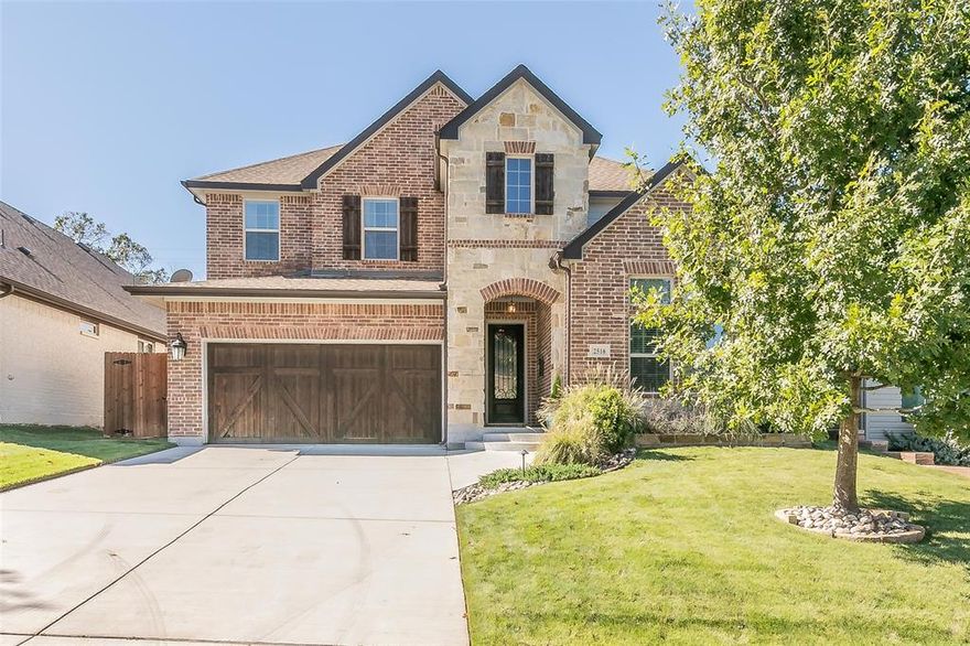 Built by David Weekley in 2016, this 2 story brick and stone home near TCU is an excellent opportunity for both families and TCU students.  The primary ensuite with walk-in closet plus second bedroom with full bath are on the 1st level and split for privacy.  2 additional bedrooms, a full bath and 2nd living area are on the 2nd floor.  You will love the high ceilings and open floor plan encompassing kitchen, designated dining and family rooms.  The home is flooded with natural light, gorgeous hardwood floors, a large 1st floor study, kitchen island, walk-in pantry, granite and stainless finish out.  The laundry room is separate and located on the first floor.  Wait til you see the outdoor living space with an entertaining pergola including grill, hot tub and covered patio.  The home has an excess of storage space and the 2 car garage with cedar garage doors is attached.  You are only minutes from TCU, the Medical District and local restaurants.