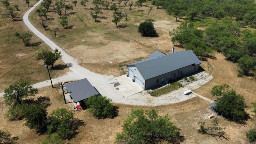 Home and 35.959 acres anyone? The pride in this home and property is evident from the moment you arrive. It had been well loved & cared for. As you drive down the long tree lined driveway you’ll notice improved pastures, 2 large tanks, & perfectly manicured lawn. The home offers 3 bedrooms, 2.5 baths downstairs, with an additional bedroom or office upstairs with full bath as well as loft area. Two story vaulted great room with massive fireplace and large windows that overlook the land. The climate-controlled garage is not just for parking, it is for basketball and even having indoor space to process deer and so much more. Garage is 35x35 and has commercial grade doors. Additional carport for more covered parking. Good size dog run and even comes with upscale chicken coop and chickens. And let's not forget to talk about the gun range, it is set up and ready to go. So much to offer, just have to see it all for yourself! This one is turn-key & ready to enjoy. Just 10 minutes from town.