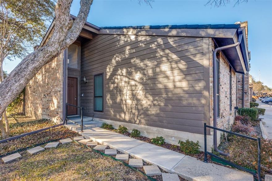 Impeccably renovated two-bedroom unit in highly sought-after Collin Greene. You are greeted by a stunning sun filled living area with vaulted ceilings, skylights and brick fireplace.  Updated kitchen with granite countertops, SS appliance package and large pantry make this home a chef's dream. Bathroom has been updated with new fixtures, designer stone, tile and countertop. Vaulted ceilings with skylight enhance the oversized shower with glass enclosure. The spacious primary bedroom has two massive, mirrored closets and separate vanity area. One-story, ground floor, end unit with separate storage and oversized private yard with recently installed artificial turf makes this home a must see. Unit has assigned covered parking, water heater 2021, roof 2018.