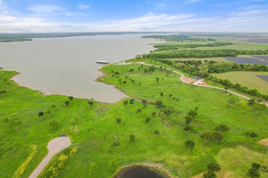 Breathtaking lot, measuring 1.66 acres, in one of the premiere waterfront subdivisions at Richland Chambers. A short 1 hour drive from downtown Dallas is an easy escape from the concrete jungle to enjoy your lakeside oasis. You can almost feel the stress melt away once you cross the FM 2859 bridge as you approach your own slice of heaven on earth.  Prepare to enjoy the breathtaking view of the lake without the hassle of maintaining a boat slip. Beyond the gated entry of Chambers Bay subdivision residents can enjoy a community pool and boat ramp for the exclusive use of its residents. The Chambers Bay deed restrictions require a site built home, with a minimum of 1,600 sq ft.