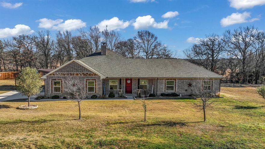 Set on two peaceful acres in Peaster ISD, this 2020 ranch-style home blends modern comfort with a beautiful sense of space. From the moment you arrive, the setting invites slower mornings, backyard sunsets, and room to breathe.

Inside, the open-concept layout flows effortlessly with stained concrete floors, soaring ceilings, and a warm living room centered around a wood-burning fireplace. The kitchen is designed for gathering featuring a large island, granite countertops, double ovens, and abundant cabinetry, perfect for everyday living and entertaining alike.

The primary suite offers privacy and comfort with a spa-style bath and oversized walk-in closet. Two additional bedrooms, plus a dedicated office, provide flexibility for guests, work-from-home, or growing needs.

Step outside to a covered back porch overlooking level acreage; ideal for evening dinners, weekend relaxation, or future outdoor plans. With no HOA, a fenced backyard, dog run, well and septic, and a side-entry garage, this property delivers both privacy and practicality.

Located just minutes from Weatherford conveniences while maintaining a peaceful country feel, this home offers the lifestyle many dream of space, comfort, and simplicity all in one beautiful package.
