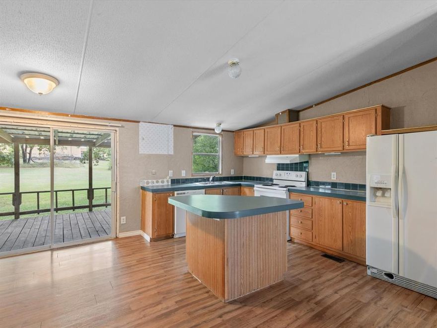 ****SPECIAL LOAN PROGRAM AVAILABLE for manufactured homes that have been moved*** Buyer must have 640 credit score or better and a minimum of 5% downpayment.  Please call listing agent for lenders information!
HIGH SPEED INTERNET! Nextlink has ran a line to home, easy to connect and start streaming immediately!  This three-bedroom, two-bath home is perfect for a primary home or investment property. Sliding glass door opens to a covered patio, perfect for porch sitting! Inside, you'll find an open floorplan that keeps things flowing nicely from one room to the next. It’s easy to imagine cooking dinner while chatting with guests or watching the game from the kitchen. All kitchen appliances will stay, if you plan to add this home to your investment portfolio, JACKPOT! The home has been well maintained, so you’ll have a solid starting point to make it your own.  The primary bedroom offers a comfortable space to unwind after a long day, and the two additional bedrooms give you flexibility—think home office, guest room, or just extra room for all your stuff… we all have it. Location-wise, you’re in good company. Harwood Park is just a short stroll away perfect for a walk or picnic. And for anyone with students in the family, Bridgeport High School is just down the road. Downtown Bridgeport welcomes you for shopping, plenty of restaurants & local events!  Whether you're looking to settle in or invest in a property with promise, this place checks the boxes. It's got good bones, great vibes, and all it needs is your finishing touch.