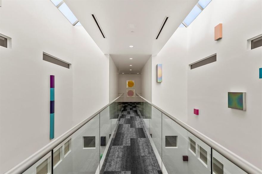 Perched on the top floor of the exclusive Art House, this exceptional property combines two units into a single, rare residence at one of Dallas’s most prestigious addresses. Designed by award-winning architect Lionel Morrison, the home features a dramatic two-story catwalk entrance leading to a spacious interior arranged around two open-air courtyards, seamlessly connecting indoor and outdoor living. The home features 10-foot museum-finished walls, skylights, honed granite and polished concrete floors, a custom marble entry, marble and stainless steel countertops, and integrated art lighting. Two master suites each offer a sitting area, large walk-in closets, and spa-like baths. Residents enjoy four private parking spaces, two storage units, and exclusive access to the on-site private gym. Ideally located at the northeast corner of Holland and Oak Lawn, the Art House provides immediate access to Dallas’s finest dining, shopping, and entertainment. Opportunity to purchase units together or separately.