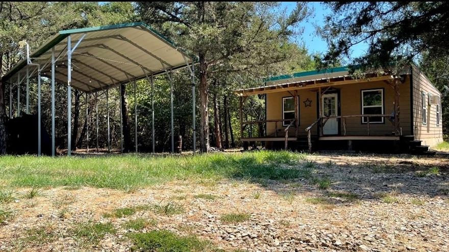 85.6 acres of land!! Beautiful property with excellent, paved road across front of the land. The property is heavily treated and is home to wildlife. Includes a fully furnished cabin, covered parking. If you have plans to build a new house or you want an investment with potential gain in the future, this is it. THE PERFECT WEEEKEND GETAWAY!!