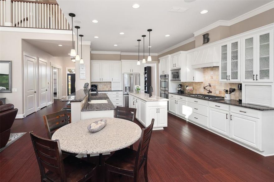 NO HOA ~ This beautifully manicured 3.06-acre property offers multi-generational living options. The grand tree-lined entrance will lead you to a custom-built 3428sqft, 3 bedrooms, 2.1 bathrooms, home nestled among mature trees. With timeless designed craftsmanship and exceptional details, such as crown molding, high ceilings, and a stunning floor-to-ceiling stone gas fireplace, this home offers an inviting blend of elegance, warmth, and refined comfort throughout.  The kitchen is the heart of the home, offering an impressive amount of counter space and storage, an oversize center island, fully equipped with double ovens, a gas cooktop, built-in refrigerator and large walk-in pantry.  Double doors lead to the first-floor owner’s suite where there are beautiful views of the property, a seating area, private ensuite bath, and a generous walk-in closet. Additional conveniences include a home office, separate mud room with sink and storage. The laundry room also offers a sink and ample storage. Step outside to the extensive covered patio, featuring a built-in grill, sink, and prep area. Ideal for gatherings or quiet evenings, the outdoor living space is a true extension of the home.  Take a sweet stroll to the surprisingly spacious 1,486sqft GUEST HOUSE featuring 2 living areas, 2 bedrooms, 1 full bath, and a beautiful eat-in kitchen - making this ideal for the multi-generation family living, flex space or home office and be sure to check out the upstairs storage! This property offers an amazing amount of parking space: with a 2-car attached garage on the main home, 2-car carport on the guest house, with additional space for RV, Boat or oversized vehicles; This property delivers a rare combination of quality, space, and versatility; Located in LovejoyISD! Convenient to Heritage Ranch Golf Resort, Woodhaven Stables, Parkside Trail, shopping, dining and so much more!  NO HOA!! Horses and livestock are welcome!! Offer Instructions and Notable Features in Transaction Desk.