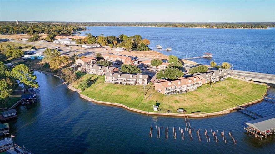 Live Like You’re on Vacation, Every Single Day. Imagine waking up to the sound of gentle waves, sipping your morning coffee with sparkling lake views, and ending your day with painted-sky sunsets over Cedar Creek Lake. That’s the everyday reality waiting for you in this ground-floor waterfront condo. This is lake living without the hassle. Step right out onto your covered patio, wander over to the community pool for an afternoon swim, and forget about mowing, exterior repairs, or weekend projects. Here, your time is truly your own. Inside, the open-concept layout is designed for easy living where your kitchen, dining, and living spaces flow together effortlessly, making everything from quiet nights in to hosting friends feel natural and comfortable. The primary suite gives you front-row views of the lake with patio access, an ensuite bath, and a generous closet. A second bedroom and full bath make guests feel welcome, and a private outdoor storage closet keeps all your lake gear tucked away and ready to go. Located in a peaceful, owner-occupied community with no short-term rentals allowed, you’ll enjoy tranquility, security, and neighbors who actually know your name. Whether you’re downsizing, looking for a weekend escape, or craving a low-maintenance lifestyle, this condo delivers unbeatable convenience in a prime lakeside location close to shopping, dining, and everything you love about the water. Life really is better at the lake, you should come see why. Schedule your private tour today!