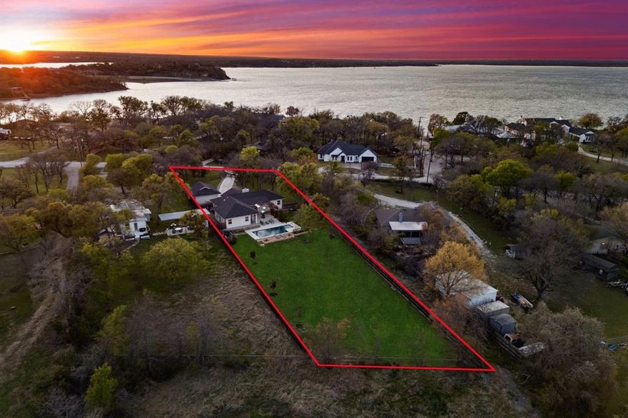 Enjoy the perfect blend of peaceful country living and city convenience in this fully remodeled home located just across the street from Eagle Mountain Lake and only 12 miles from downtown Fort Worth! Wake up to scenic sunrises, the sights and sounds of nature, with abundant wildlife in a quiet, small-town atmosphere that feels miles away from it all. This 3-bedroom, 2-bath home was completely remodeled in 2023 by Fort Worth’s Luxury Home Builder, Lyle Reid and features a new roof, new HVAC system, and a whole-house water purification system. The open-concept layout connects the living, dining, and kitchen areas, all overlooking a sparkling pool and private patio making it ideal for entertaining or relaxing. The kitchen is equipped with stainless steel appliances (all included), quartz countertops, custom cabinetry, and designer lighting. Bathrooms feature quartzite and quartz surfaces and updated fixtures. The exterior offers a gated entry, long driveway, modern stucco finish, and a detached oversized two-car garage. There is also ample space for boat, RV, or jet ski parking. The large backyard backs to mature trees for added privacy and offers plenty of room to build a guest house, MIL suite, or workshop. The new pool and spa include a blue light cleaning system for reduced chemical use and easier maintenance. Located just minutes from Twin Points Park, marinas, lakeside dining and 10 minutes from Azle and Lake Worth. A rare opportunity for updated lakeside living with space, privacy, and modern upgrades!