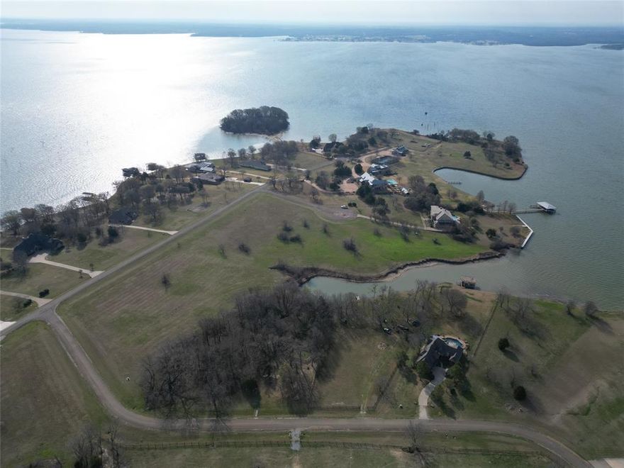 RARE WATERFRONT TRIFECTA ON RICHLAND CHAMBERS RESERVOIR! This is a once-in-a-generation opportunity to secure one of the most significant land holdings in the exclusive, gated Arrowhead subdivision.
THE LAND & WATERFRONT: This offering is comprised of three distinct parcels, each with its own unique character. Lot 38 (1.36 Acres) boasting an incredible 300 linear feet of expansive waterfront. Lot 39 (1.82 Acres) offers 65 linear feet of water access, while Lot 40 (2.2 Acres) provides an additional 100 linear feet of shoreline. Combined, you have 465 linear feet of private waterfront. Whether you choose to purchase a single lot for a secluded retreat or secure all three to create a sprawling 5.38-acre masterpiece.
THE LIFESTYLE: Life at Richland Chambers is defined by the rhythm of the water and the serenity of nature. Imagine waking to the sound of birds and the gentle lap of waves against your shore. Start your day with a peaceful sunrise paddle in your canoe or kayak, exploring the hidden coves of the reservoir. Launch your boat from the private, resident-only boat ramp to enjoy 41,000 acres of blue water. This is a world-class destination; these waters are legendary for trophy catfish, crappie, white bass, and hybrid stripers. As evening falls, the horizon transforms into a fiery canvas of Texas sunsets—the ultimate backdrop for entertaining on your future expansive deck or relaxing by a lakeside fire pit.
SUPERIOR STANDARDS: Protect your investment in a community that values quality. Arrowhead is a restricted, gated community featuring underground co-op electric and water at the road front to preserve unobstructed lake views. Homes are limited to site-built residences with a 2,500 sq. ft. minimum.
LOCATION & CONVENIENCE: Experience the best of both worlds—the profound quiet of the lake and the convenience of the city. Located just 65 miles from the heart of Downtown Dallas, this is the premier weekend escape for the DFW professional.