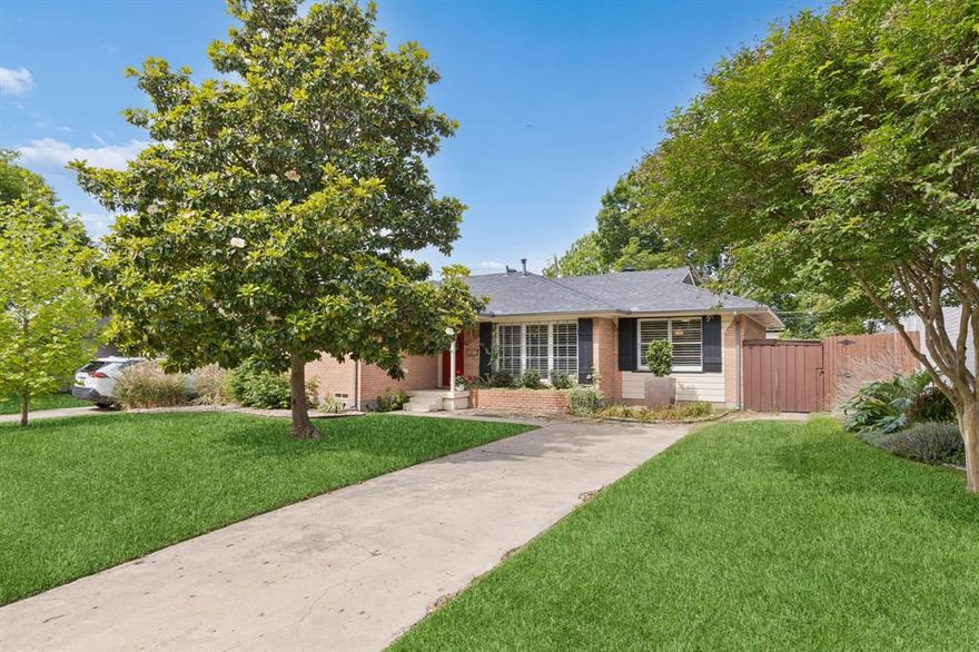 This charming L Streets home sits on a spacious, tree-filled lot with beautiful, mature landscaping that creates a warm and inviting curb appeal. Inside, you’ll find a great floor plan designed for both everyday living and easy entertaining. A rare four-bedroom layout for the neighborhood, this home features an updated kitchen, ample storage, and seamless flow into the dining and living areas.

Hardwood floors run throughout the main living spaces, while plantation shutters add timeless style and character. The oversized primary suite offers a generous walk-in closet, and the full-size utility room just off the kitchen adds everyday convenience.

Step outside to a private backyard retreat complete with a large grassy yard, perfect for play or pets, and a wood deck ideal for outdoor gatherings. The detached garage is accessed via the rear alley and features an electric gate entry for added privacy and security. Ideally located, this home offers walkability to the well-loved Lake Highlands schools and parks, with easy access to White Rock Lake and enjoying all the neighborhood has to offer.