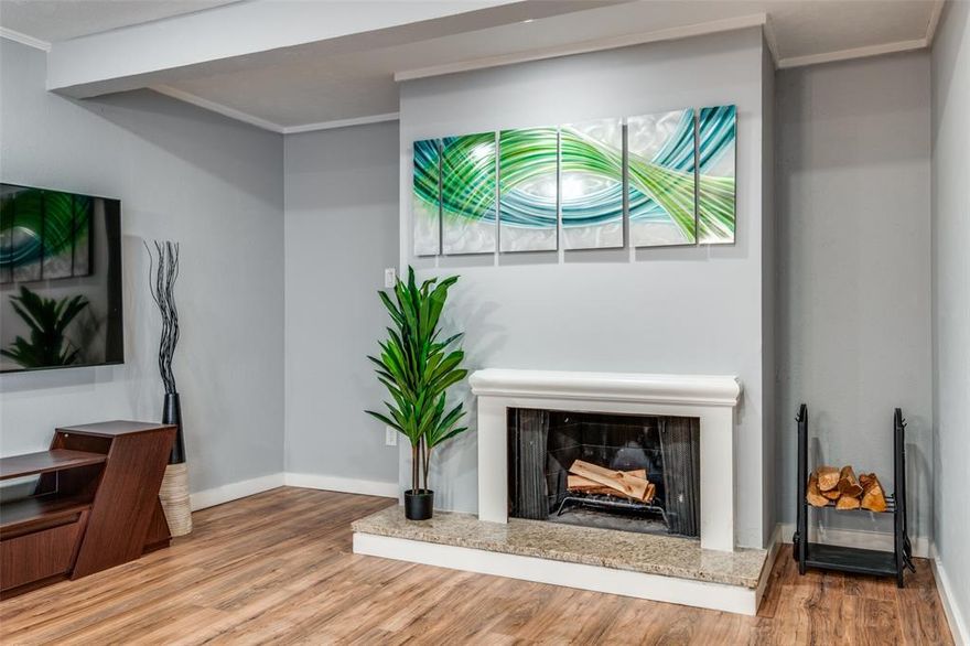 Beautifully updated and move-in ready 2-bedroom, 1-bath second-floor condo in a PRIME Oak Lawn location just off Wycliff Ave and the Dallas North Tollway. Set in a charming 37-unit community with a lush courtyard and sparkling pool, this home offers a bright, clean, and well-maintained feel throughout. Recent updates include energy-efficient windows installed by the HOA in 2021 and a completely new HVAC system in 2022 for added comfort and efficiency.
The spacious living room features a wood-burning fireplace and opens to a modern kitchen with stainless steel appliances, white cabinetry, marble backsplash, and quartz countertops. Tile floors and showers have been refreshed, and fresh paint throughout creates a cohesive, move-in ready. The primary bedroom offers flexible space for a home office or sitting area. 
Enjoy your private balcony, a utility closet with stackable washer and dryer included plus bonus storage, and one assigned parking space with ample street parking. It is conveniently located minutes from Uptown and Downtown with easy access to major highways, dining, shopping, grocery stores, and parks.