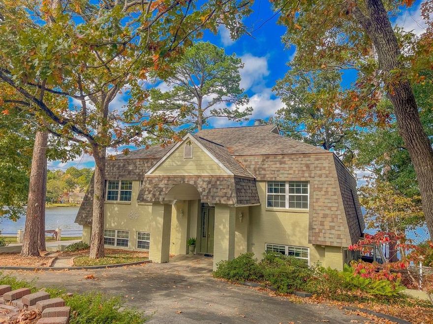 YOUR OWN HOME ON THE LAKE AT BEAUTIFUL HIDEAWAY! This 4BR, 2.5 bath, 3 car garage home with boathouse, cabana and RV parking is a rare find. The porches face North to relax with your coffee in the morning or wine in the afternoon with full view of the lake! The upper and lower level overlook the lake with great views from the living area, kitchen, dining, primary ensuite, and huge bedroom downstairs. The primary bedroom and one guest bedroom are on the main level with the 2 additional bedrooms downstairs giving privacy for your guests Offering tons of storage, great master closet, custom unit of shelves and cabinets in the Jack & Jill bath, built in storage in the kitchen as well as pantry, an office area adjoining the primary bedroom. The oversized 3car garage 32 wide x 20.6 deep allows space for a workshop, golf cart parking, boat trailer storage. The boat docks on the lot just west of this home are a real plus to allow extra parking.Come see this FABULOUS home today!