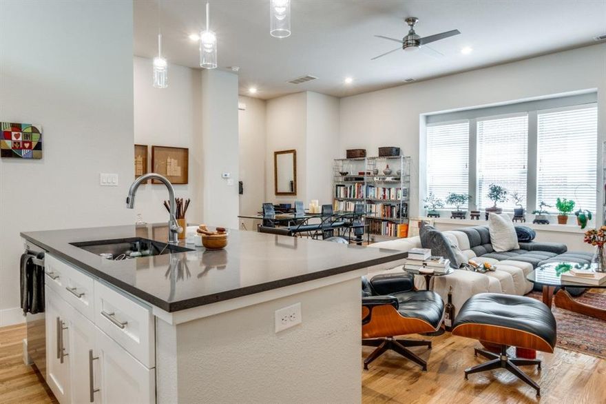 Gorgeous modern style condo conveniently located steps from Lower Greenville. Laid out over three stories, this 2016 construction home displays its quality with hardwood floors throughout, oversized windows, and a rare GeoThermal HVAC system. The second floor boasts an open floor-plan, greeting you with a spacious living room, dining room, and well appointed kitchen featuring stainless steel appliances, induction stove-top, and soft-close drawers. The third level, with its 12' ceilings, gives way to a luxurious primary suite with a Carrara marble vanity and large walk-in closet. The guest bedroom is well-appointed, with a closet and en-suite bathroom. The outside areas are the highlight of the house, featuring a 500 sqft rooftop deck and turfed back patio, the perfect spots for hosting. HERS rating of 40 means it is 60% more efficient than a standard new home and significantly less in electric bills. Attached 2 car garage, board on board privacy fence, $300 a month HOA.