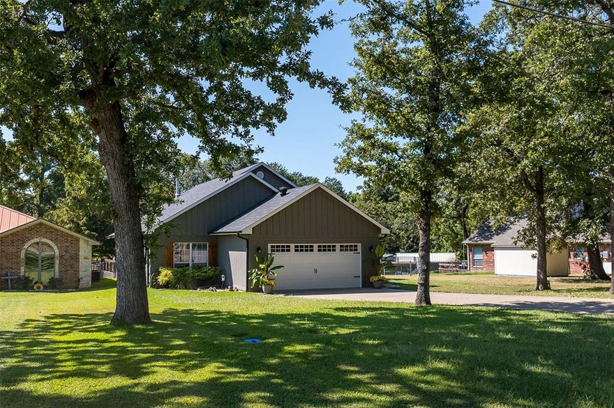 Welcome to your Cedar Creek Lake retreat! This beautifully maintained lakefront home blends upgraded comfort with easy, relaxed lake living. Step inside to vaulted ceilings, walls of windows framing lake views, and an open living and dining layout. The owners converted the carport to an attached garage, installed a new HVAC system, and added a warm wood-burning stove — a perfect season-spanning feature. This home features 3 bedrooms, 3 bathrooms with two primary suites. Outside, enjoy your own covered dock & lift, lakeside deck, and direct access to the water. The setting invites entertaining, sunsets, fishing, boating — whatever your lakeside dream is. The lot is generous, offering outdoor living, shade, and lake frontage that few homes deliver. What sets this home apart: the sellers are willing to negotiate their 2023, 18-ft Sun Tracker pontoon bass boat and selected furniture in the deal — giving you a nearly turnkey lake home. With updates already in place, your major costs are minimal, and you can move right in or begin enjoying rental income if you choose. Lakefront, updated, and offered at $630,000 — this property won’t last long. Schedule your showing today and live your best lake life at 127 Rueda Encina.