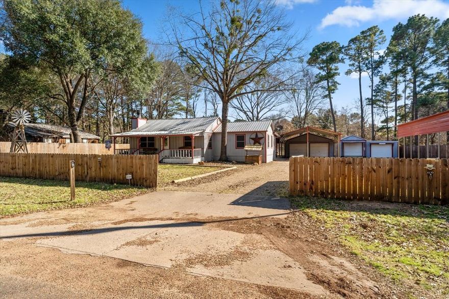 Lovely 4-Bedroom, 2-Bathroom Home in Cedarview Estates Lake Community. Welcome to this spacious and charming 4-bedroom, 2-bathroom home, offering plenty of room for everyone. Nestled in a peaceful lake community, this property is perfect for those seeking both comfort and outdoor adventure. The home boasts a cozy stone fireplace, ideal for relaxing evenings. Enjoy your mornings or unwind after a long day on the inviting covered front porch or the spacious back patio, both perfect for outdoor living. It also features a spacious family room and dining area, private office, and large utility room. With two garages, a golf cart garage, and a separate storage area with electric, this property offers ample space for vehicles, hobbies, and all your storage needs. For RV owners, the covered RV parking area comes with an electric hookup and separate entry gate, making it easy to store and enjoy your RV. The entire property is fully fenced for privacy, with an electric gate adding an extra layer of security and convenience. This home is located in a desirable lake community, complete with a boat dock and park—ideal for boating and enjoying the serene surroundings. Whether you're relaxing at home, exploring the lake, or entertaining guests, this property offers everything you need and more. Don’t miss out on this incredible opportunity—schedule your showing today!    All details to be verified by buyer-buyer agent including but not limited to lot size, square foot, utilities, appraisals, surveys, easements, restrictions, and school information.