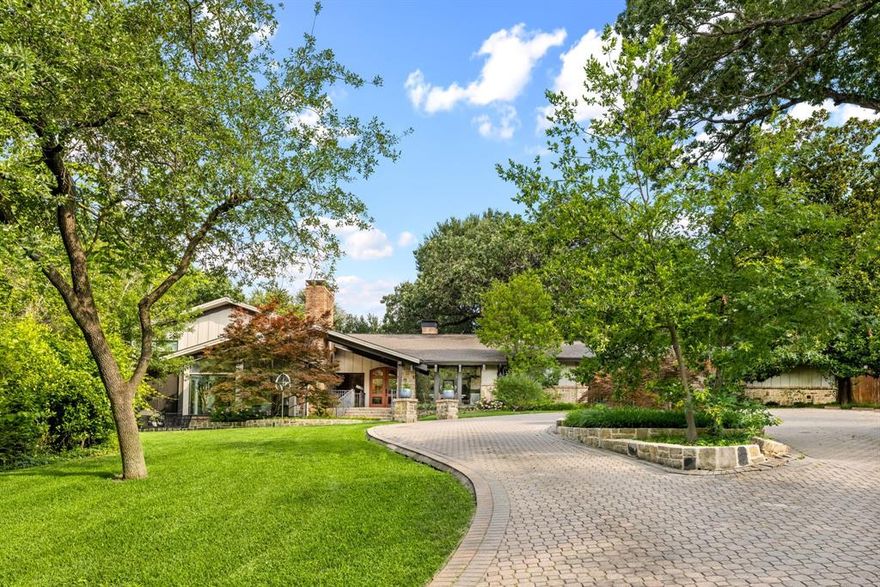 Nestled on 1.37 acres, this exceptional mid century modern estate offers the perfect blend of quiet luxury, peaceful privacy and contemporary comfort. Soaring ceilings, sleek architectural details and expansive glass windows frame tranquil views of the pond, endless trees and winding creek, bringing the beauty of nature indoors. The main level showcases generous living spaces, a meticulously renovated kitchen, and an elegant primary suite complete with stunning updated bath and a private enclosed patio. Additional highlights include a stylish office or music room with Pierre Frey wallpaper, a guest bedroom with an en-suite bath, a utility room, and a chic powder bath. Upstairs, you'll find two spacious bedrooms with two full bathrooms, and an additional living space — perfect for relaxation or hosting guests. Step outside to your own sprawling backyard paradise featuring a sparkling pool with a hot tub and diving board, a gazebo, and lush surroundings ideal for entertaining or unwinding. A three-car garage and carport provide ample space for parking and storage. Conveniently located with easy access to downtown, scenic walking trails, and premier shopping and dining, this home is thoughtfully designed for effortless indoor-outdoor living. Don’t miss this rare opportunity to make this extraordinary retreat your own.