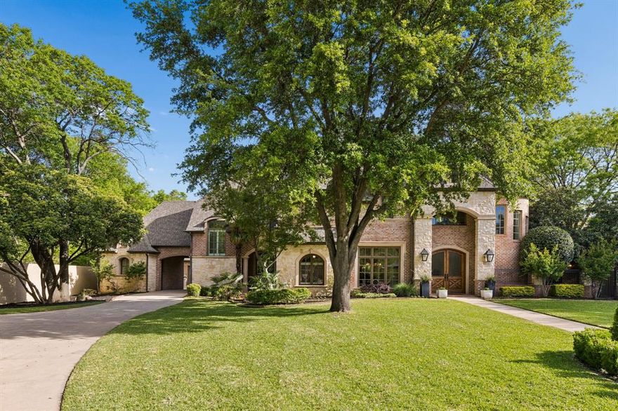 Updated two story home situated on a spacious .72 acre cul-de-sac lot, surrounded by mature trees and thoughtfully designed for comfort and functionality.  The open floor plan features living room with views of the backyard, a private office, and a cozy family room with a fireplace. The main level includes a primary suite and a guest suite, making everyday living both convenient and practical. A downstairs guest bedroom features its own private entrance and en-suite bath. The primary features marble countertops, an oversized shower, soaking tub, and a custom designer walk-in closet.
The kitchen has been recently updated with custom cabinetry, Wolf range, and built-in appliances.  Bar area off the kitchen overlooking the counters has a second full size refrigerator and wine fridge- perfect for entertaining while overlooking the pool and oversized backyard. Upstairs offers three more bedrooms with two full baths, a spacious game room, and a dedicated media room providing plenty of space for family. Additional highlights include a three car garage with a porte-cochere.