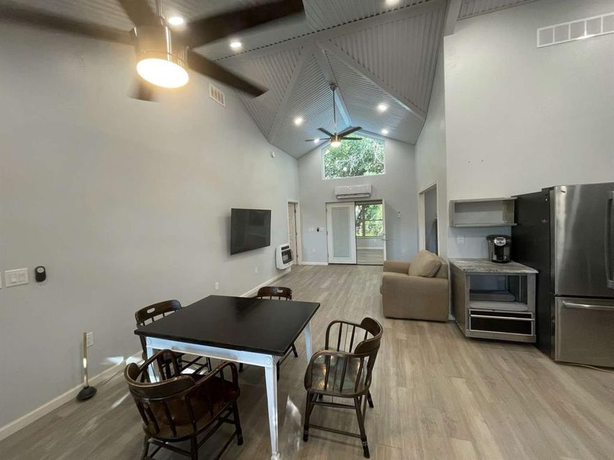 Very modern and efficient home built with energy saving features. Large open kitchen including 48” Viking stove. Well insulated. on-demand natural gas water heater and HVAC is supplied via efficient Minisplit heat pumps to keep you comfortable all year round. Backup heat is also installed via natural gas wall infrared heater. LED dimmable lights and big windows make it a bright happy home. Tucked away in the south end of a country feel street with quiet neighbors and lots of trees make this a peaceful environment. underground safe room-storm shelter. The hot tub is another feature adding to the relaxing environment on this property. Parking for several vehicles (including RV Parking) is available under 1200 sq ft of car port or in the detached garage. The 1400 sq ft garage Shop is also insulated with spray foam and cooled-heated via Mini split system. Water, Sewer, Natural Gas, Electric is also run to Garage shop. All of this hidden away on .93 acres country feel