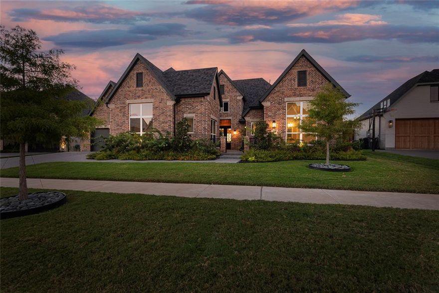 Exclusive Peninsula location—where elegance meets nature—this stunning one-story Traditions-built home is ideally positioned on a coveted greenbelt lot in Windsong Ranch, offering breathtaking sunset views.
This exceptional residence features four bedrooms, each with its own en-suite bath, along with thoughtfully designed spaces including a private study or home office with a wall of built-ins and barn doors—perfectly blending comfort, style, and functionality.
The family room impresses with a cathedral ceiling accented by wood beams, a statement chandelier, and a cozy fireplace. Triple sliding doors open to a covered patio, creating a seamless indoor-outdoor living experience.
The chef’s kitchen is designed for entertaining, showcasing high-end appliances, a massive island, and an adjacent butler’s pantry with abundant storage, space for an additional refrigerator or freezer, and a fully redesigned walk-in pantry.
The primary suite serves as a luxurious retreat overlooking the greenbelt, complete with a spa-like en-suite bath and a well-organized closet featuring a built-in island chest of drawers that conveniently connects to the laundry room.
Outdoor living is equally impressive, featuring a fully tiled patio, built-in BBQ, and sink—perfect for enjoying evening sunsets. See photo gallery.
Additional highlights include approximately 300 square feet of bonus storage space with second-floor access from the three-car garage, offering potential for conversion into a finished retreat. The oversized split three-car garage features an epoxy-finished floor, electric vehicle charging outlet, and ample space for a workshop, classic car, or additional storage.
Residents enjoy the exceptional amenities of Windsong Ranch, including a freshwater lagoon with a sandy beach, tennis courts, resort-style pools, scenic walking trails, and convenient access to the Dallas North Tollway, US 380, and PGA Frisco.