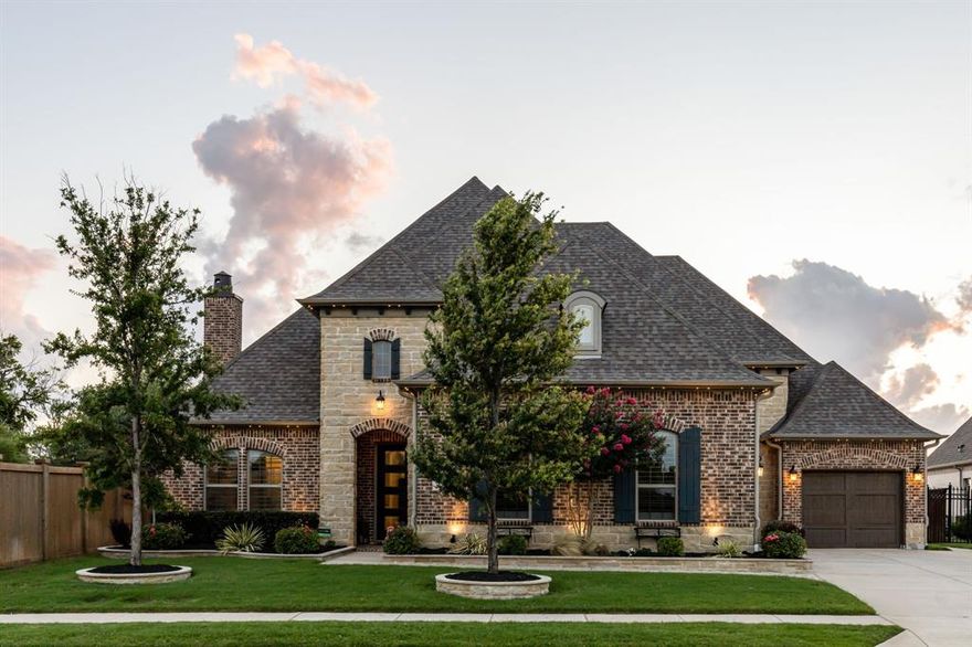 **Offers received - highest and best due by Monday July 1st at noon**

Embrace the ultimate waterfront lifestyle at 7616 Castlebridge, The Colony. A Taylor Morrison home on the shores of The Tribute, a resort golf community! This highly sought after Waterford Point home in The Tribute features 3 bedrooms,3.5 bathrooms with an office, and a generous 3486 square feet of living space, all situated on a spacious lot. 

Indulge in luxury with upscale finishes throughout, creating an ambiance of refined elegance. The gourmet kitchen is equipped with high-end appliances and a wine cellar, perfect for culinary enthusiasts. 

Outside, the allure continues with a beautiful spa-pool and outdoor living space with a gas fire pit, offering a serene retreat with stunning expansive waterfront views. Plus, as part of a community with abundant amenities, you'll enjoy a lifestyle of convenience and leisure. 

Don't miss the opportunity to make this waterfront paradise your own.