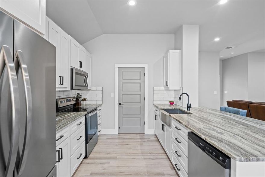 Sellers are motivated! Welcome to this beautifully maintained 3 bed, 2 bath home built in 2022, located in the gated Canyon Creek community on Lake Granbury. Situated outside the city limits, this property offers the perfect blend of privacy and convenience, just minutes from HEB grocery store, shopping, and dining in Granbury’s historic town square. Step inside and enjoy the open concept living space featuring light colored luxury vinyl plank flooring and 10' ceilings throughout. The kitchen is a chef’s dream with granite countertops, island seating, 42 inch tall shaker cabinets, a stainless steel farmhouse sink, built-in microwave, walk in pantry, and a cozy breakfast nook. Recessed lighting and modern fixtures add to the home’s bright and airy feel. The primary bedroom is thoughtfully separated from the secondary bedrooms for added privacy. The spacious primary bath includes dual sinks, a makeup vanity, and a large walk-in shower. Enjoy outdoor living in the fenced backyard with an extended patio, perfect for entertaining. This home is energy efficient with foam insulation in the walls and attic. Canyon Creek offers fantastic community amenities, including a clubhouse, two pools, tennis and basketball courts, a baseball field, playgrounds, picnic areas, docks, and a fishing pier. This home is walking distance to one of the pools and playgrounds, and the community is gated with a 24-hour guard for added security. Don't miss the opportunity to live in this wonderful lake community!