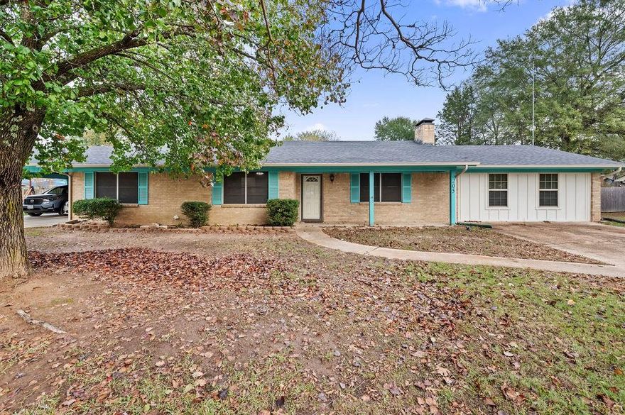 VA assumable loan available for those who qualify. Charming Brick Ranch in the Heart of Quitman! Perfectly positioned on quiet Wayside Dr, this inviting 4-bedroom, 3-bath home is just a stroll to Quitman Elementary and minutes to the hospital, grocery, dining, and downtown conveniences. Warm wood-beamed ceilings and a wood-burning fireplace create a cozy living space, while the functional galley kitchen and oversized laundry room offer everyday ease with space for an extra fridge or freezer. A standout feature is the two private primary suites with full ensuites, ideal for multigenerational living, guests, or long-term stays. The newer addition showcases dual walk-in closets, granite double vanity, custom built-ins, and a spa-style walk-in shower. Step outside to a spacious fenced yard, perfect for pets and play, plus an attached 2-car carport with direct entry, storage building, and storage container. Comfort, convenience, and room for everyone—this one truly checks all the boxes!