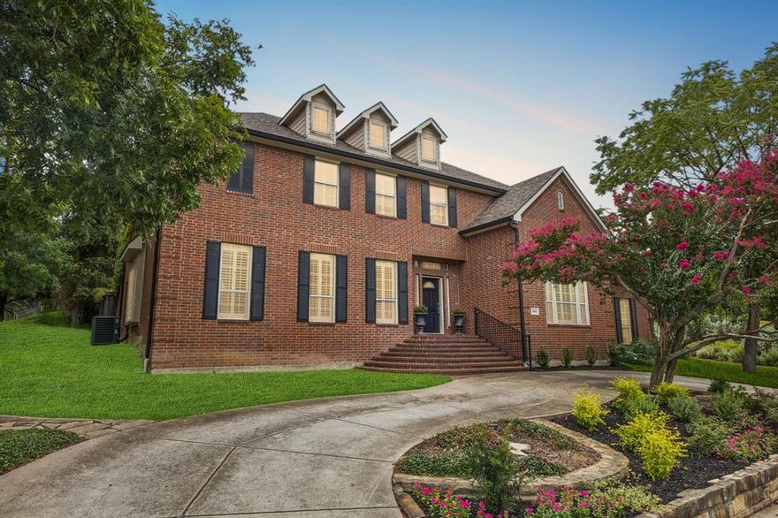 Set on a spacious corner lot in Lake Highlands’ coveted Town Creek, this 5-bedroom home offers 4,458 sq. ft. of light-filled living with tall ceilings and expansive windows. Inside, you’ll find a gracious formal living room, a downstairs family room that flows off the kitchen, and an upstairs game room perfect for play or movie nights. The chef’s kitchen features professional-grade appliances, double ovens, and a generous pantry, all open to the main living spaces for easy entertaining. The downstairs primary suite has been completely updated with a spa-like bathroom featuring a separate tub and shower and a large walk-in closet. Additional bedrooms offer flexibility for family, guests, and a 6th room makes the perfect tucked away office. With 6 bathrooms, a sparkling pool, large yard and a 3-car garage, this home blends scale, style, and function in one of Lake Highlands’ most desirable neighborhoods.