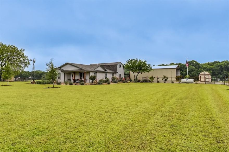 Set on over 2 acres, this well-maintained custom home offers a versatile floor plan with a spacious living room and seamless flow from the kitchen to the dining and living areas. The oversized primary suite is conveniently on the main floor, while two additional bedrooms and a full bath are upstairs. Flexible floor plan with a nice office or hobby room as well--you decide how you want to use this space! Oversized laundry room with storage & extended mud room is handy, too. Enjoy no carpet, fabulous natural light, & abundant storage closets throughout! The half bath downstairs is perfect for guests. Step onto the covered rear porch to relax or utilize for outdoor entertaining. Additional perks include a 50x25 covered parking which is an ideal space for RV or car storage, with an additional RV water & sewer hookup, and a 12x24 storage shed with loft. Refrigerator, mounted tvs, washer and dryer stay! This is a perfect place for buyers seeking space, privacy, low maintenance and practical features all in one home. Pride of ownership shows! County taxes, Waxahachie address & Red Oak schools.