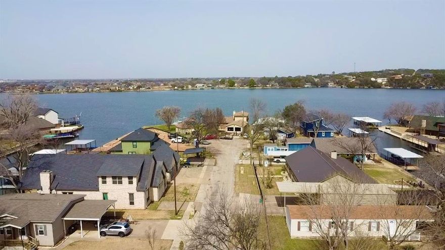 Here's your chance to be on the water!!! This beautiful community awaits you. This house has a private ramp and boat dock for your boat and jet-ski. 3 Bedrooms, 2 baths, and a Fireplace.  Make this place your vacation get away or build your own dream home.