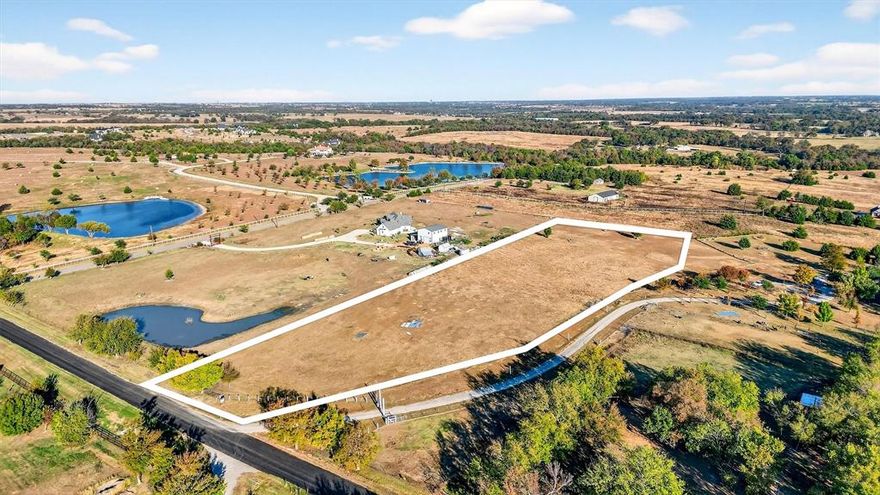 This 6-acre tract, being subdivided from a larger property, offers a rare opportunity to own prime land in one of North Texas’s most desirable locations. Positioned at one of the highest elevations in the area, the property provides expansive country views and an ideal setting for a custom home, barns, pool, and outdoor living. Located in the LoneStar area of Celina, the tract is surrounded by estate-style homes and spacious lots, ensuring privacy, scenic surroundings, and long-term property value. This property is perfect for buyers seeking privacy, space, and the ability to design a custom lifestyle in a highly sought-after North Texas location.