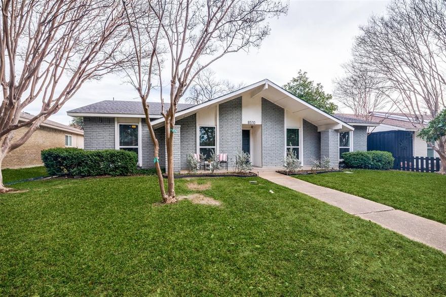 Welcome to 8510 Sikorski, a gem tucked into a neighborhood that radiates pride of ownership, where tree-lined streets and meticulously cared-for homes create a true sense of community. Ideally located near the Dallas Arboretum, White Rock Lake, and Casa Linda Shopping Center, this beautifully updated single-story home offers modern comfort wrapped in timeless charm. Step inside to discover an open layout transformed in 2020 with thoughtful updates throughout, including new flooring and updated windows that enhance both style and energy efficiency. The heart of the home—the kitchen—shines with its 2020 remodel, featuring granite countertops, a farmhouse sink, new appliances and a sliding window over the sink which opens to the backyard. A sliding glass door provides abundant natural light and opens to the covered patio, seamlessly blending indoor and outdoor living. The inviting living room is highlighted by a stunning floor-to-ceiling stone fireplace, creating a cozy centerpiece that’s perfect for gathering. Just off the kitchen, a versatile bonus room awaits—whether you need a home office, playroom, or an extra bedroom, this space adapts to your lifestyle.
Freshly painted with three spacious bedrooms, two updated bathrooms, and a large fenced backyard with a covered patio for entertaining or unwinding, this home has it all. An oversized two-car garage with an attic for storage is an added bonus. Walking distance to Lakeland Hills Park, which offers walking trails, tennis courts, skate park, dog park, and a playground - this lush green space offers something for everyone.