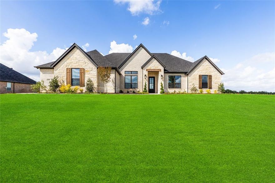 Welcome to your dream home, a brand-new construction masterpiece from the Signature Series by renowned builder Couto Homes. Perfectly situated in the prestigious South Bend Estates, this stunning Hampton model offers nearly 3,000 square feet of thoughtfully designed single-story living that combines luxury, comfort, & sophisticated design. From the moment you step through the 8-foot iron front door, you are greeted by a breathtaking barrel ceiling in the entryway, leading you into an expansive open-concept living area featuring a spectacular coffered ceiling & a floor-to-ceiling stone fireplace with a rustic cedar mantle. Wood like flooring flows seamlessly through the main living areas, study, & game room. The gourmet kitchen is centered around a large island with a contrasting stain finish. Custom-painted cabinetry is raised to the 10-foot ceiling, featuring lighted glass-front uppers for a touch of elegance. This dream kitchen is equipped with stainless steel appliances, including a gas cooktop and a double oven, drawer microwave, and beautiful granite countertops. Thoughtful details like a pull-out spice rack, utensil holder, & soft-close drawers make this kitchen as functional as it is beautiful. Retreat to the luxurious primary suite, which boasts a box ceiling &  a stylish barn door entry to the spa-like ensuite bath. The bathroom is your private oasis, featuring a large walk-in shower with a frameless glass panel, a freestanding pedestal tub, dual vanities with an above-counter cabinet & decorative mirrors & stunning closet. The luxury extends outdoors to the covered porch featuring stained beadboard ceiling & a convenient gas stub for your grill—perfect for relaxing or entertaining. 3-car garage with steel doors, decorative hardware, & a durable epoxy floor finish provides ample space for vehicles & storage. For maximum comfort & efficiency, the home includes a radiant barrier roof decking, foam lid insulation & a 14 SEER Trane HVAC system. Come see it!