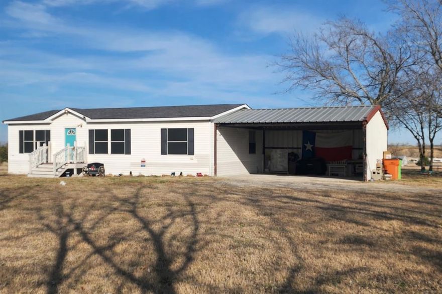 A rare opportunity to own a versatile and private piece of North Texas. This 5.00-acre AG-exempt property offers low taxes, no HOA, and no deed restrictions, providing flexibility for a variety of uses.  The well-maintained 2009 double-wide manufactured home (28x44), classified as real property, features 3 bedrooms and 2 full bathrooms. Recent updates include luxury vinyl plank flooring, roof, HVAC system, double carport on a concrete slab, and an aerobic septic system installed in 2021.  The land includes two stock tanks (ponds) and approximately 1,000 feet of combined FM and county road frontage, offering excellent accessibility, visibility, and potential for future expansion or additional homesites. Utilities are available along the county road. Ideal for livestock, horses, hay production, or private rural living. Conveniently located on a low-traffic FM road with easy access to Celeste, Leonard, Wolfe City, Commerce, and Greenville, approximately 45 minutes to McKinney and 20 minutes to Greenville.  Motivated seller is open to negotiation.

Additional MLS reference: MLS #21016618
Raw land address: To be assigned by the Hunt County 911 Office upon buyer’s selection of driveway location.