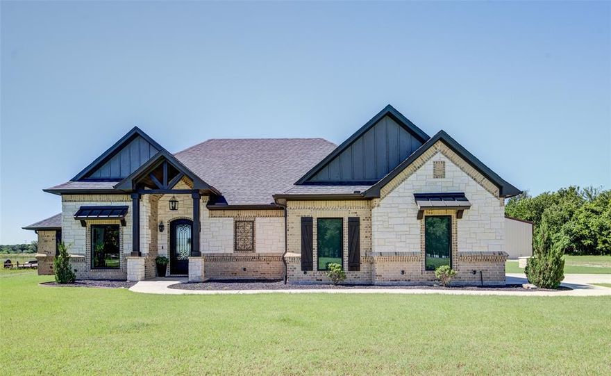 Country living with all the amenities of a city build, and now: We have a price change. Lucky you. Welcome to this stunning home nestled on 4.2 serene acres, offering the perfect blend of modern living and country charm. The home kitchen has great use of space for a gourmet chef, and its 6 burner stove and double oven. The living quarters opens with glass 3 way pocket doors for full accessibility to the outdoor space. This light-filled home has great finishes and thoughtful design throughout. The land is lush with established native Bermuda grass, ideal for outdoor enjoyment. An aerobic septic system and a reliable well provide sustainable utilities plus in the home garage is a storm shelter. For the car enthusiasts, hobbyist, entrepreneur, the property boasts a massive 2,400 sq ft shop—perfect for projects, storage, or even a home-based business including its own washer and dryer and RV parking. With plenty of space to roam and grow, this property delivers peaceful rural living just a short drive from town conveniences