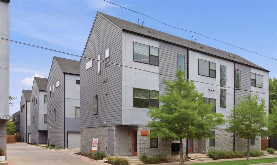 Live steps from the Bishop Arts District’s best coffee shops, restaurants, boutiques, yoga studios, and live music, yet tucked inside a quiet, private corner unit within a community of just 24 homes that feels worlds away from the bustle. This beautifully designed condo delivers walkability, modern comfort, and exceptional value without ever needing to get in your car.

This home blends clean, contemporary style with thoughtful functionality. The main level welcomes you with soaring ceilings and oversized windows that fill the space with natural light, highlighting the open-concept living area and sleek modern kitchen with stainless steel appliances*, quartz countertops and Carrara marble tile backsplash. Window shades throughout provide comfort, privacy, and light control. Wide-plank engineered wood floors and a seamless layout make this floor ideal for entertaining or unwinding after a night out. A versatile nook provides the perfect work-from-home setup.

Upstairs, both bedrooms retreat to the top floor, each with its own private ensuite bath. The primary suite features a dual vanity and a large, beautifully tiled walk-in shower, creating a spa-like escape.

Built in 2020 with energy-efficient construction, the home offers improved energy performance and potential for lower utility costs, a standout advantage in today’s market. The lower HOA fees add even more value and include water, sewage, trash, and management of common areas, helping keep monthly costs predictable.

The community offers two fenced courtyards with green-spaces, perfect for relaxing outdoors, enjoying fresh air, or giving pets room to roam. Additional perks include a gated dog run for pet owners and a two-car garage with dedicated storage on the lower level.

Modern, efficient, and perfectly positioned between vibrant city energy and peaceful community living, this home offers a lifestyle that’s connected, quiet, and effortlessly low-maintenance.