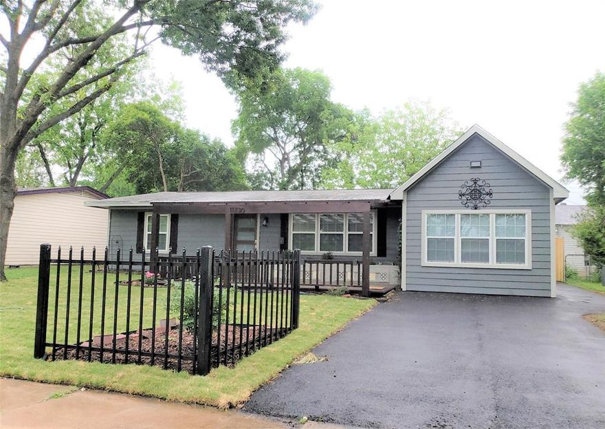Charming curb appeal and full of personality, this super cute home welcomes you with a beautiful covered front porch—perfect for morning coffee or relaxing evenings. Inside, you’ll find 3 spacious bedrooms and 2 full baths, all thoughtfully updated during a remodel completed approximately 7 years ago. The bright, eat-in kitchen shines with crisp white cabinetry, sleek granite countertops, and modern conveniences including an electric range and built-in microwave—ideal for both everyday living and entertaining. Both bathrooms have been tastefully upgraded with white cabinetry, updated laminate flooring, and contemporary fixtures. The spacious primary suite offers a relaxing retreat, complete with a large shower and a cozy sitting area in the bedroom. Major updates like the roof and windows provide added peace of mind, while the expansive backyard—enclosed by a privacy wood fence—offers endless possibilities for outdoor fun, gardening, or gatherings. Conveniently located with easy access to major roads and I-635, this home combines comfort, style, and accessibility. A true gem you won’t want to miss!