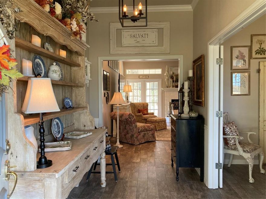 Private and peaceful country estate on over 10 acres on a very quiet cul de sac. Large screened front porch overlooks beautifully manicured southern pasture with mature pecan, black walnut and live oak trees. Property also features a seasonal pond. Northern pasture also has mature live oaks and some wooded areas for wildlife. Large family room and sunroom with custom awnings overlook a sparkling pool. Pool house has an outdoor bathroom and shower. Huge 64x50 garden features 2 greenhouses and 50+ raised beds complete with a drip irrigation system. There is also a small orchard with fruit trees. The workshop features 4 bays and can accommodate 3 vehicles. The 4th bay has been converted into a 400 square foot climate controlled storage room. Peaceful, country living near the Chalk Bluff area, but only minutes from shopping and downtown.