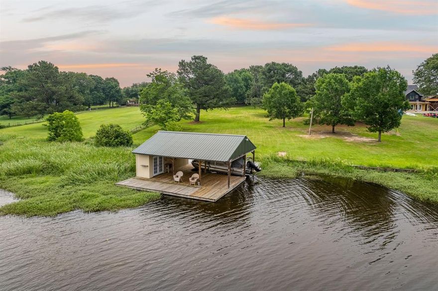 Perfect for either a weekend retreat or full time residency, this incredibly spacious lakefront home features 180 linear feet of shoreline on a two-acre lot. Situated in arguably the most beautiful part of Lake Athens, the tree-shaded grounds offer beautiful views and abundant wildlife.  Enjoy world class bass fishing right off the large boathouse or wake up to the site of a herd of deer grazing just outside the back door. The home has two primary suites (one on the ground floor and one upstairs), a large bunk room, and several flex spaces. With a new roof and new exterior and interior paint, the well-built home is ready for your new vision inside.