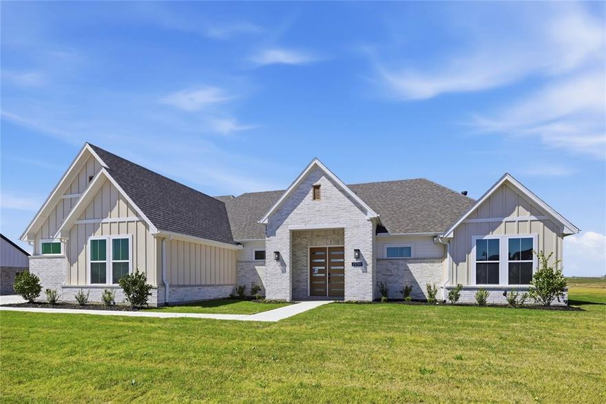 Set on just over an acre in Waterfall Ranch, 2230 Tutt Trail offers the space, privacy, and ease of single-story living in a thoughtfully designed new build. Inside, the open-concept layout is centered around a vaulted great room with clean lines, modern lighting, and a fireplace with a simple surround and mantle. Expansive windows bring in natural light and frame views of the surrounding property, while the space flows naturally into the dining area and kitchen—creating a layout that works well for both everyday living and entertaining.

The kitchen features rich cabinetry, a large quartz island with seating, stainless appliances, and a streamlined tile backsplash, offering a balance of function and design. Nearby, the dining area is positioned for easy access to the patio and backyard. The private primary suite is set apart with a quiet, comfortable layout and a well-appointed bath complete with dual vanities, a soaking tub, walk-in shower, and modern finishes. Two additional bedrooms are supported by two full baths, while a separate game room provides flexible space for media, work, or a playroom.

Wide-plank flooring runs through the main living areas, complemented by soft neutral tones and abundant natural light throughout the home. With over an acre to work with, the property offers the flexibility to expand over time—whether that means adding outdoor living, a pool, or simply enjoying more space and privacy. A well-designed single-story home offering space, comfort, and flexibility in Waxahachie.