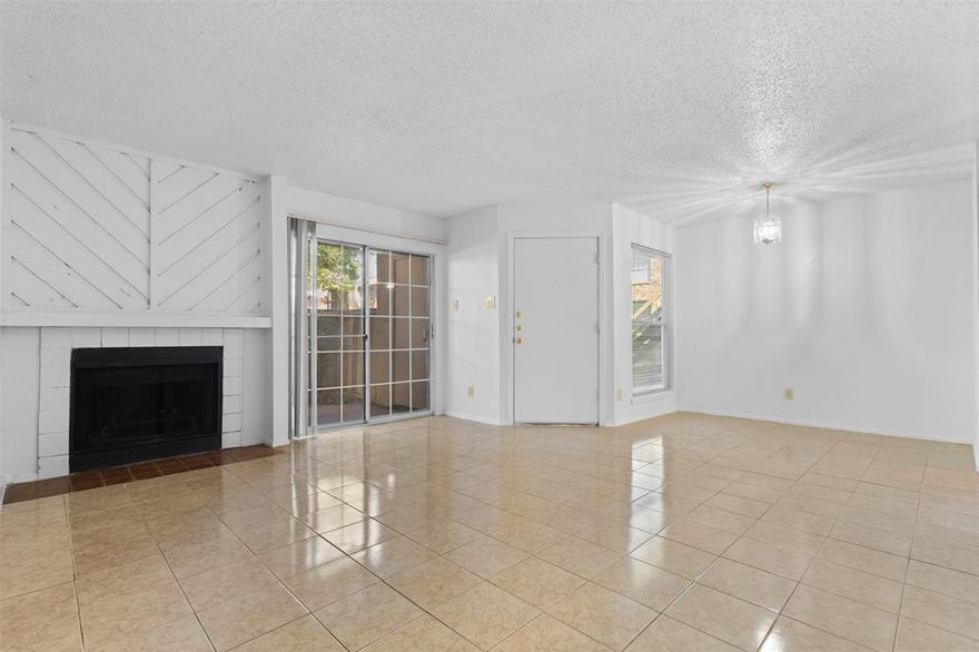 **Back on market due to buyer financing** Don't miss your opportunity to see this MOVE-IN READY condo! NEW HVAC system, Quartz countertops, tile floors throughout the main living space, carpet in both bedrooms with walk in closets, a private patio with storage, wood burning fireplace, large utility room for washer and dryer with storage space, and located all within a gated community. The refrigerator does convey with the sale of the home. HOA does take care of water and trash, and you have access to the community pool. Being in a prime location to 635 and having access to public transportation, this condo is ideal for any owner or investor. Don't miss your chance to view this property!